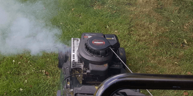 Traditional Lawn Mower Emitting Smoke