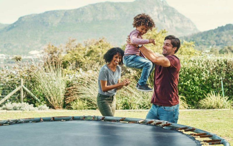 Supervising Child's Playtime on the Trampoline